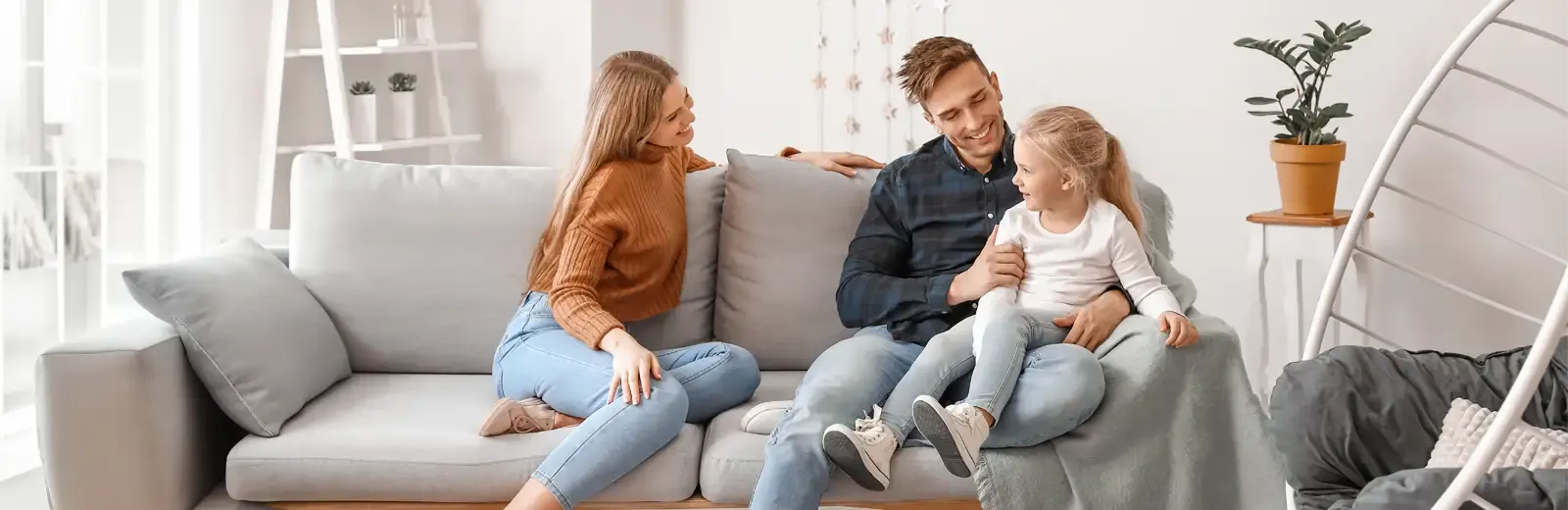 family on couch laughing